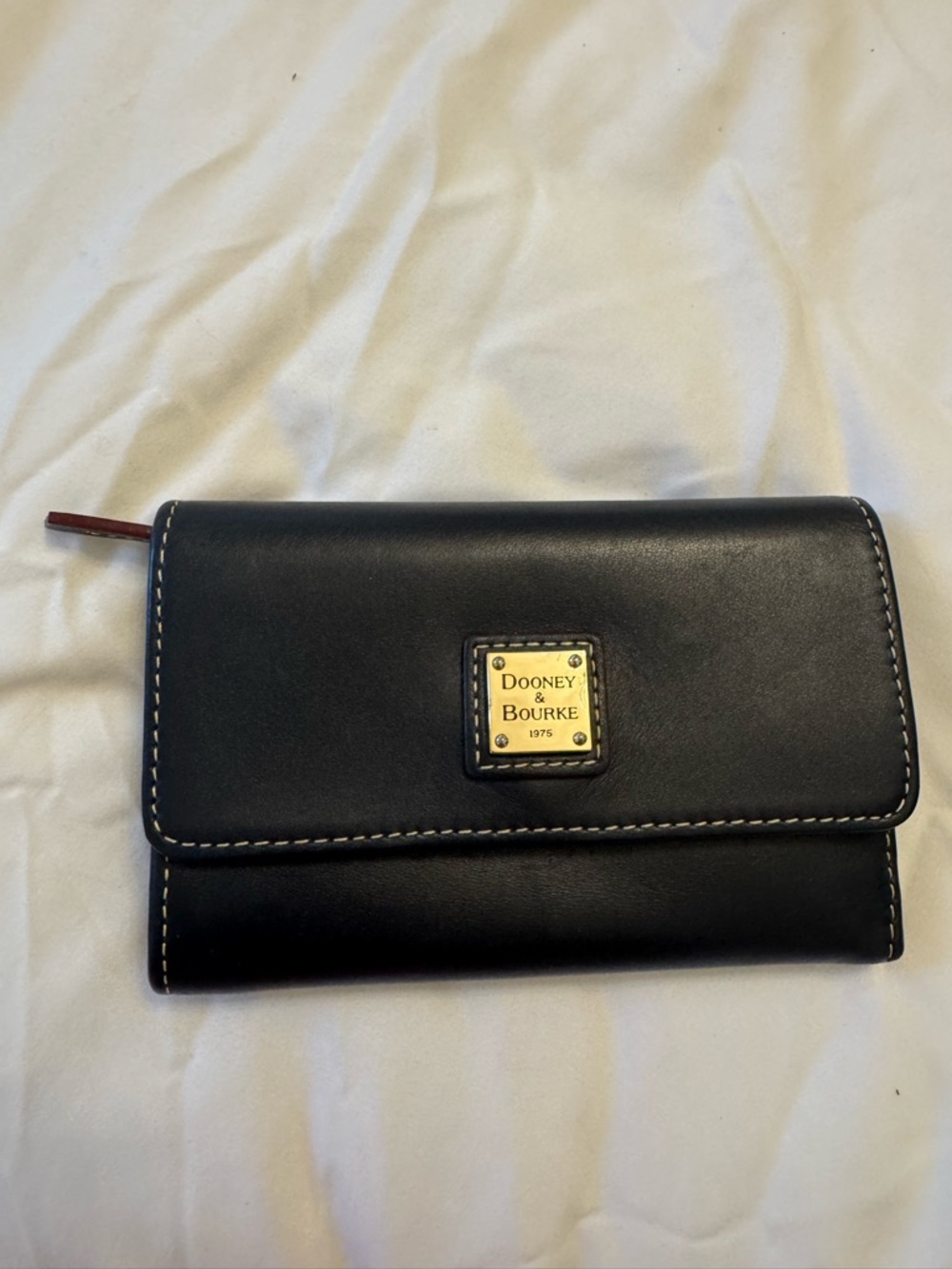 Dooney & Bourke Navy Leather Wallet with Gold Plaque and White Stitching